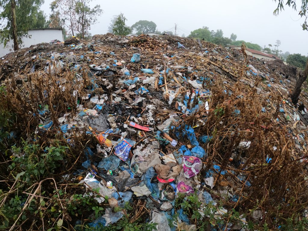 Waste pile in Ndirande, Blantyre showing large amounts of plastic waste.